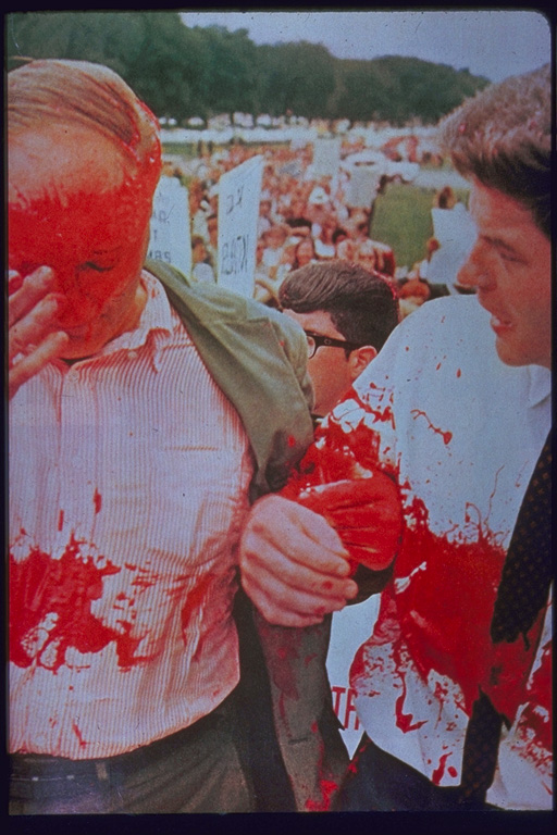 Dave Dellinger and Staughton Lynd splattered with red paint, Washington DC 1965