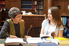 Librarian Anice Mills works with student