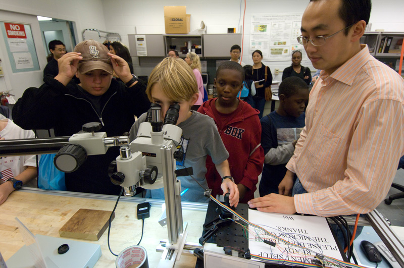 Wei and Student at Robotic Setup