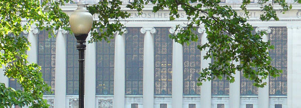 Butler Library seen through the trees near Low Library.