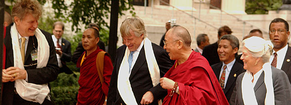 The Dalai Lama speaks with Columbia President Lee Bollinger during his visit to the World Leaders Forum.