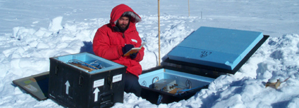 Michael Studinger, a scientist with the Lamont-Doherty Earth Observatory, conducts research activities near the Vostok Station in Antarctica.