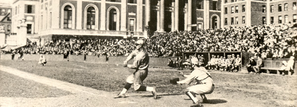 Gehrig playing in game on South Field, 1923. Caption on back of photo reads: "Lou Gehrig while a student at Columbia at bat in a varsity game. Gehrig was a Columbia pitcher who joined the N.Y. Yankees a few weeks after Yankee scouts saw him in a game in 1923."