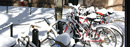 Snow-covered bicycles at the Amsterdam Avenue entrance to College Walk.