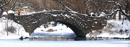 A snow-covered bridge in Central Park, designed by John Howard & Samuel Cauldwell in 1896.