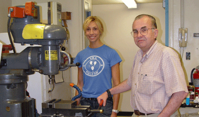 Lou Cleveland and Erica Marion discussing some fine points of machine shop practice