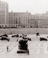 Columbia's fourth home: Morningside Heights Cars drive along 116th Street with Alma Mater in the foreground