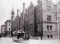 Columbia's third home: East 49th Street and Madison Avenue Two horses pull a streetcar in front of a four storey Gotchic building
