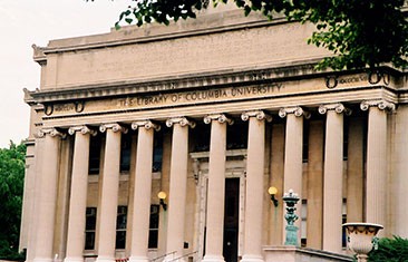 Stately grey building with row of columns