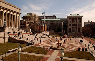 Students walking across plaza in front of Low Library