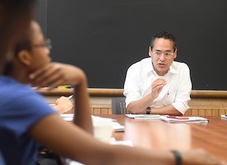 Columbia University faculty member teaching a seminar.