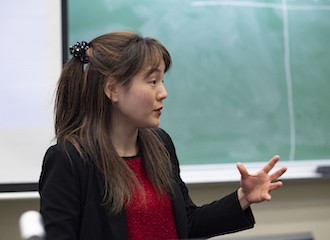 Columbia University faculty member teaching in a classroom.
