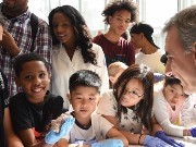 kids crowd around a table