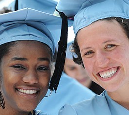 Two columbia graduates in mortar boards