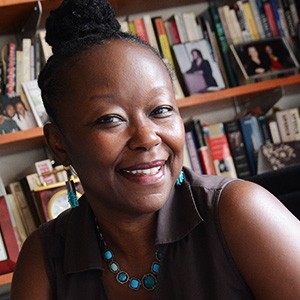 Farah Jasmine Griffin, a woman with dark, pulled up hair, smiling. 