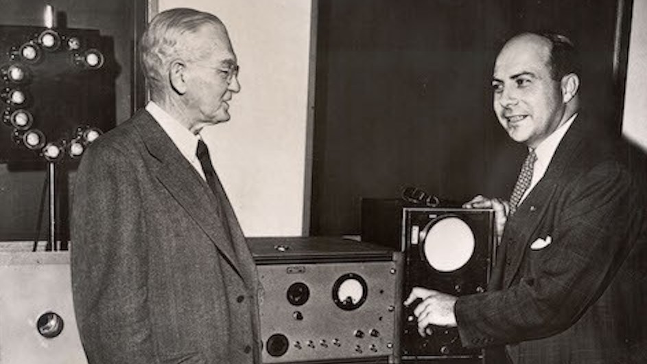 John R. Dunning (right) points out to Dean George Braxton Pegram the workings of his "atomic pinball machine," which he uses to explain atomic energy to the public.