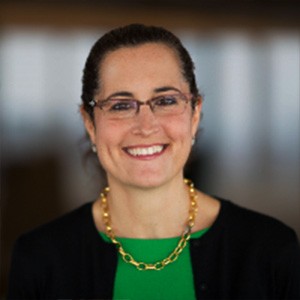 Lisa Carnoy, a woman with dark hair and glasses. 