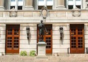 A photograph of the front of Hamilton Hall, with the statue of Alexander Hamilton centered.