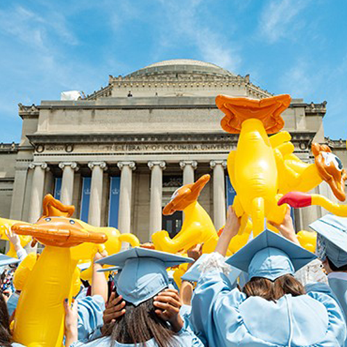 inflatable lions held by Columbia grads in front of Low Library