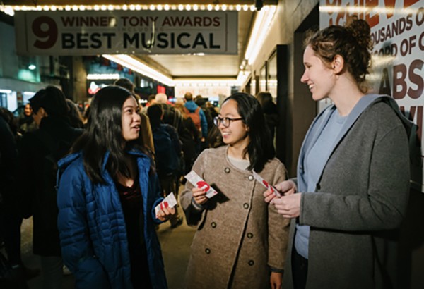 group of women gathered at an arts event