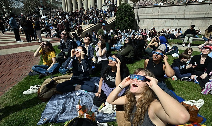 Look Up! 8 Luminous Photos From an Eclipse-Viewing Gathering on Low Plaza