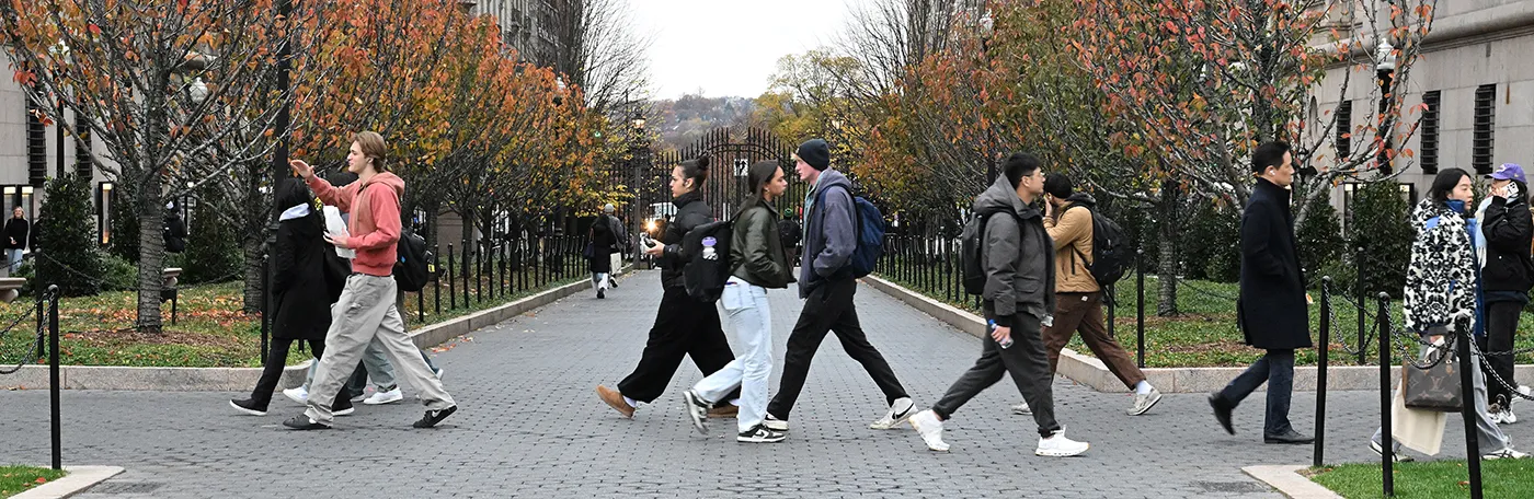 On a fall, day, people cross College Walk on Columbia’s Morningside campus