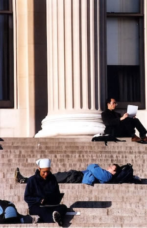 students studying on steps of lowe library